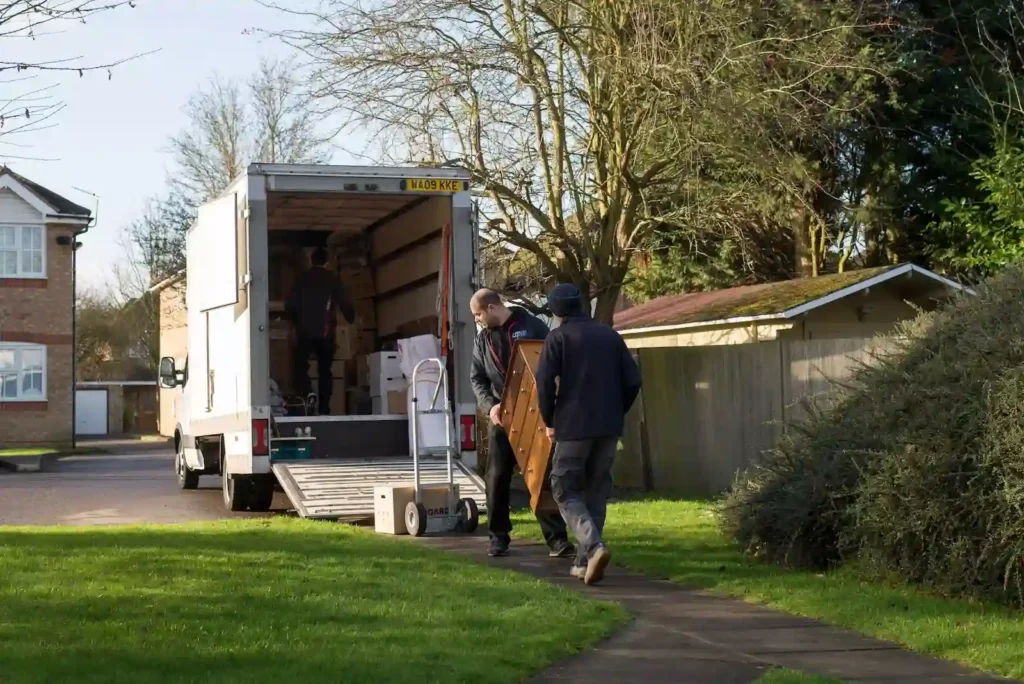 Professional removals South London team unloading a van in a residential street near Greenwich