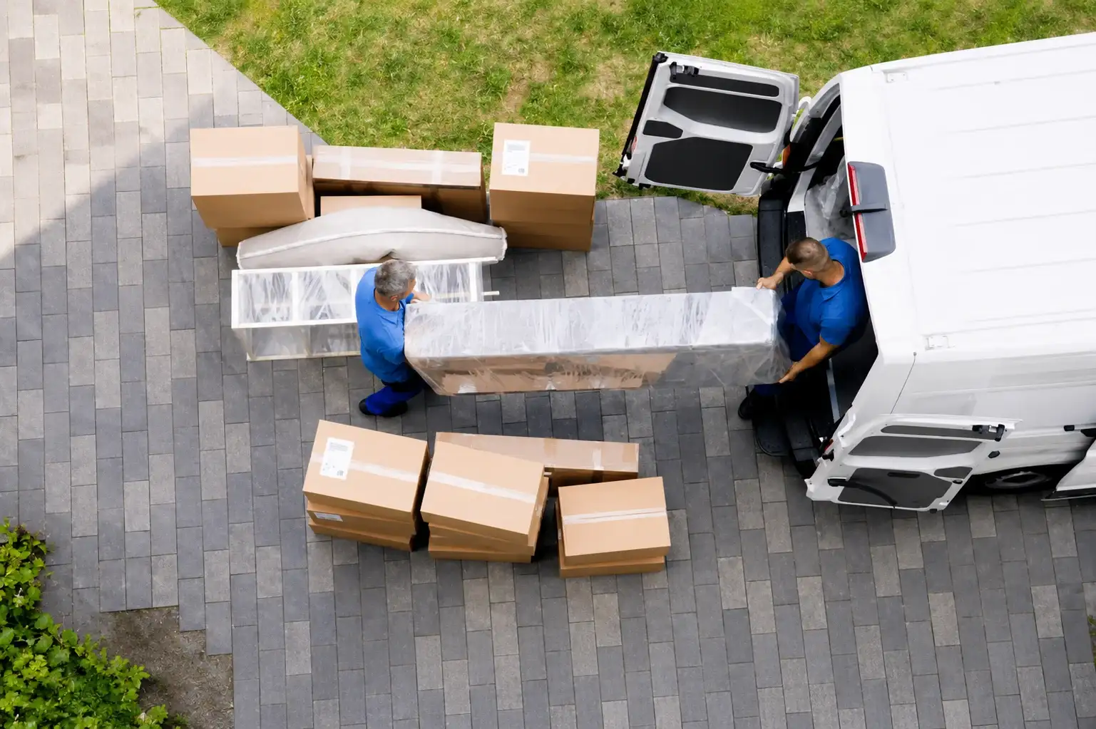 Professional team performing removals East London service with cardboard boxes